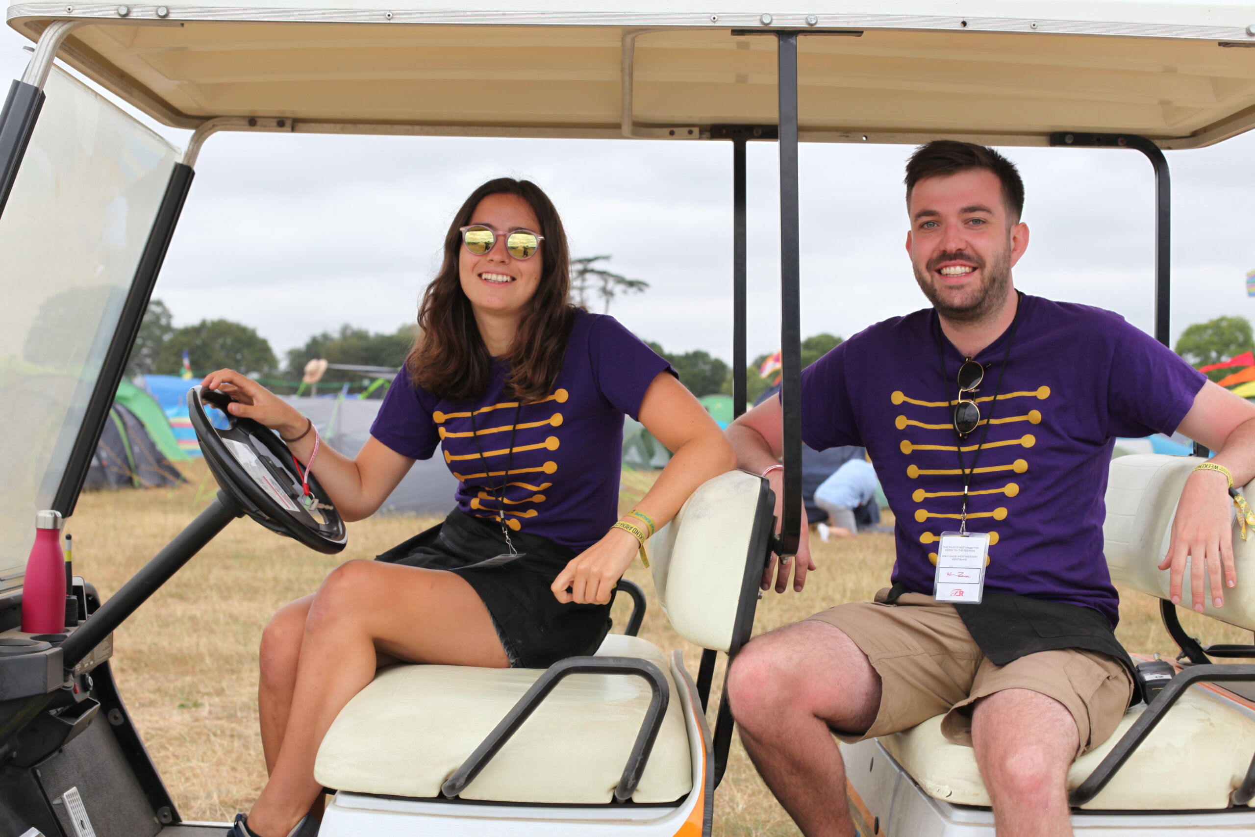 Volunteer workers sitting on a Charity Concierge buggy