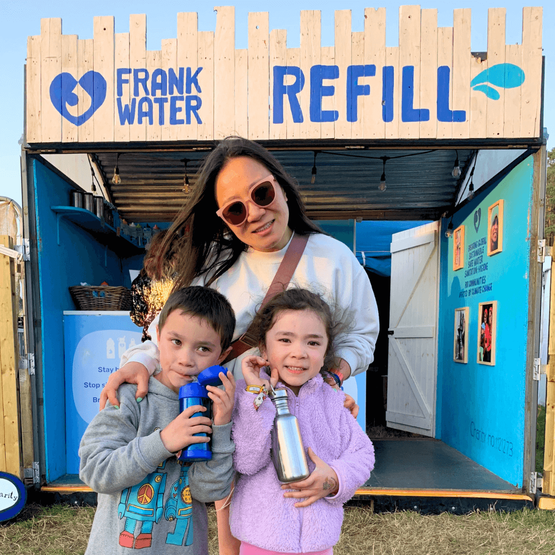 Family in front of Frank Water Refill Station